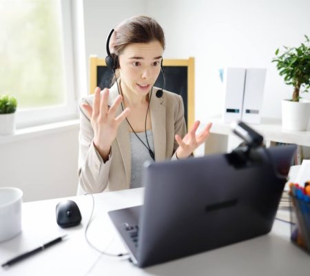 young-woman-is-learning-language-with-laptop-computer-camcorder-and-headphone-online-at-home--r0d71spaberudcf0p2wh8ogh62mi29jut3qer8vihk
